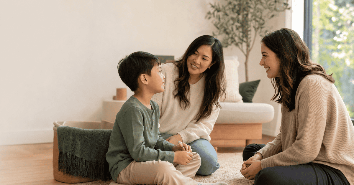 Child, caregiver, and speech-language pathologist in a home-based session
